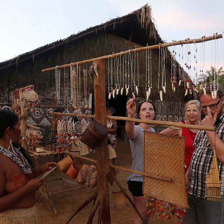 people looking at indigenous jewelry